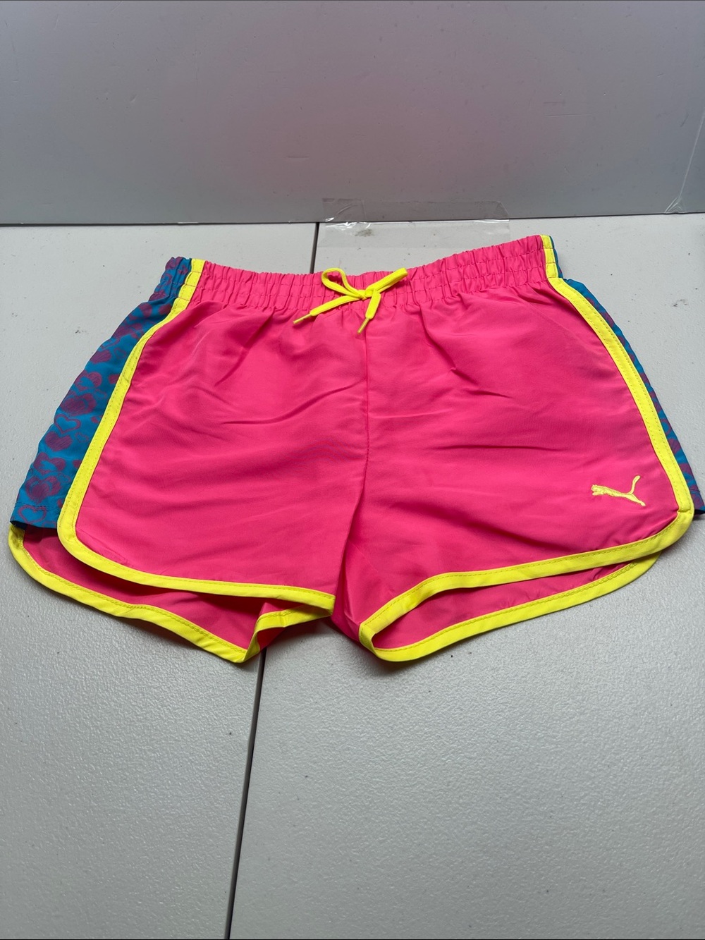 Puma Pink Athletic Shorts with Yellow Trim and Blue Side Panels